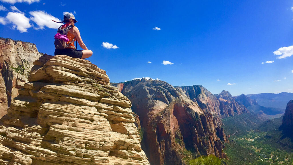 Clare pausing for a meditative break at Angel’s Landing in Zion National Park.