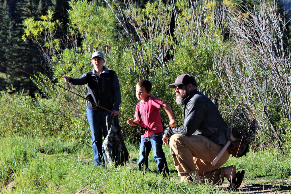 PJ Dufour and others outside fly-fishing