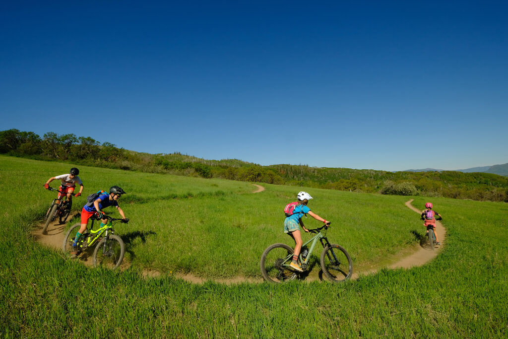 Mountain bikers riding down a trail
