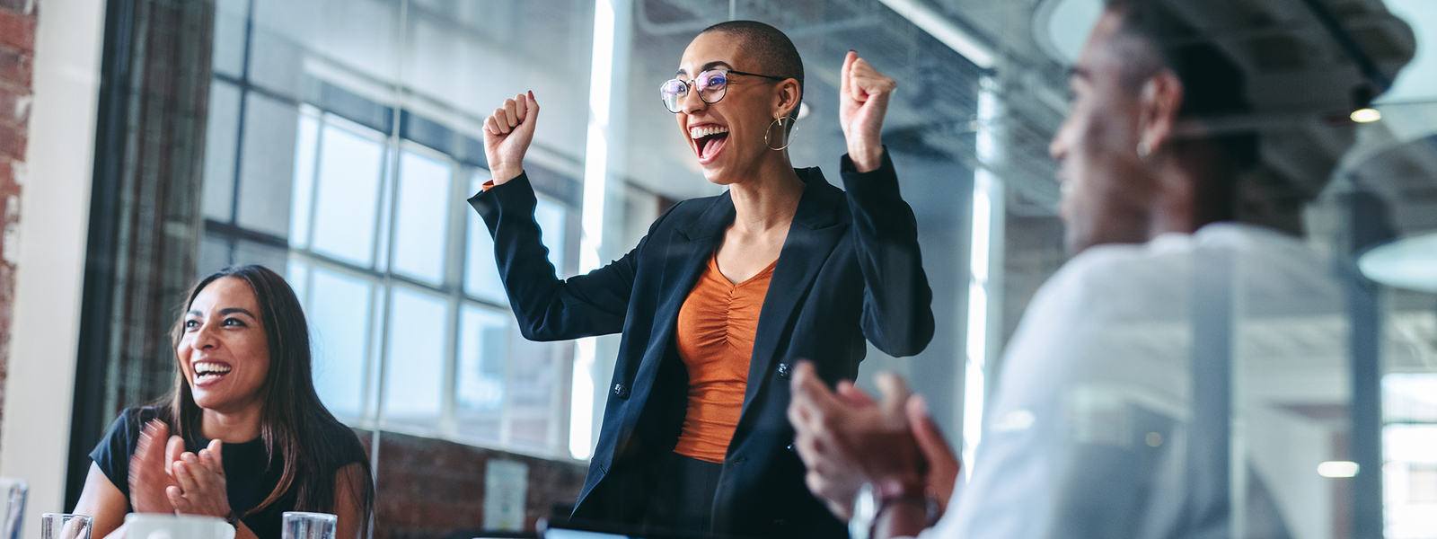woman cheering in business room